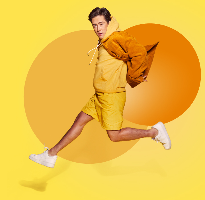 man jumping on yellow background